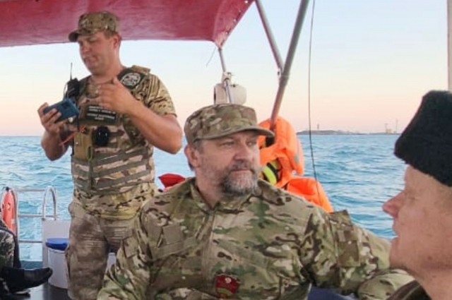 Олег Чихачев с сотрудниками инспектирует акваторию заповедника.