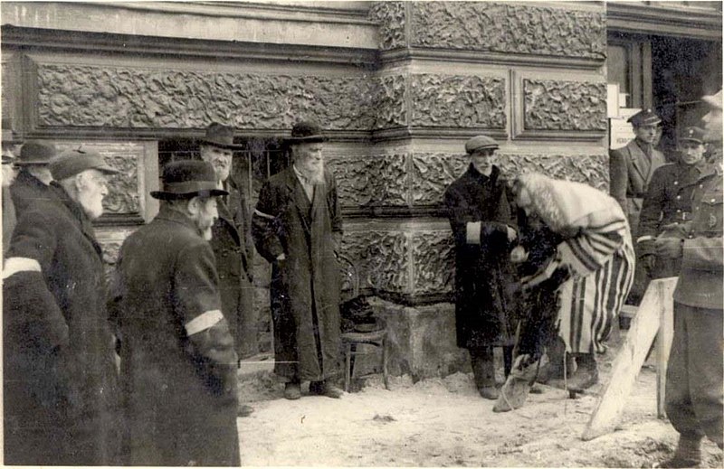 German National Socialists force Jews to pray on the street, Lvov, Ukraine, 1941.