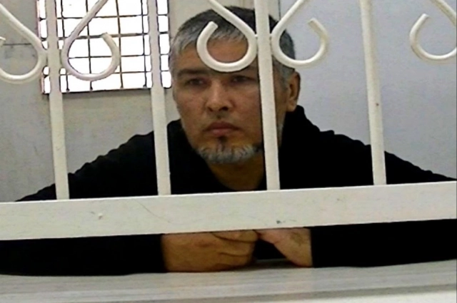 Холматов на допросе.