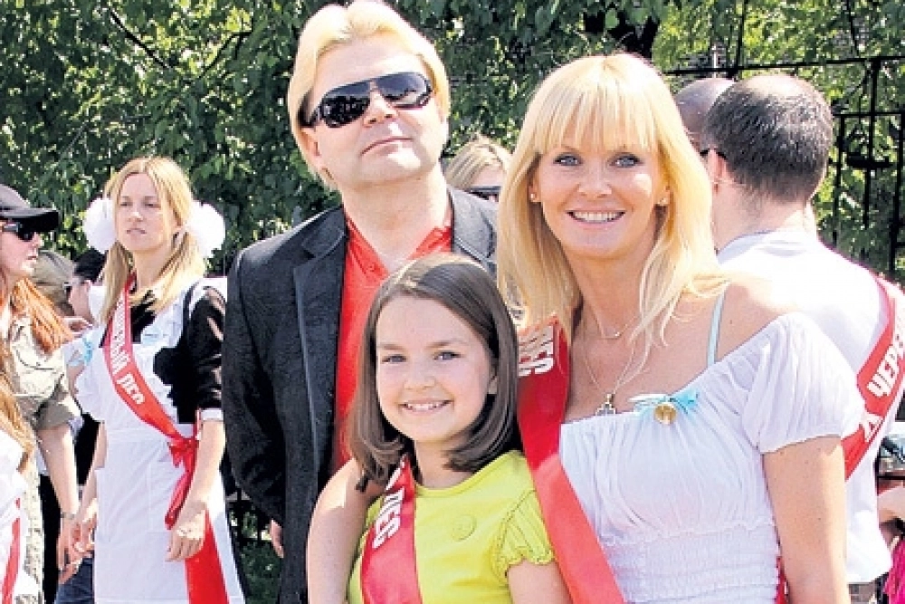 Андрис и Екатерина с дочерью.